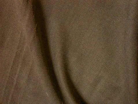 Dark Brown Wool Fabric Texture with Folds and Fibers, Cozy Textile Close-Up.. Stock Photos