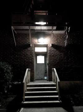 Dark Building with Light on Steps Fotos de archivo