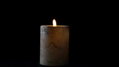 Dark candle burning close-up with black background Stock Footage 126061008
