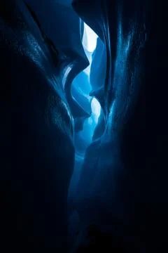 Dark canyon inside the ice Stock Photos
