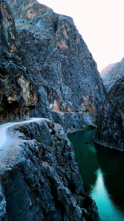 Dark canyon river with dramatic mountain road footage Stock Footage 320964713