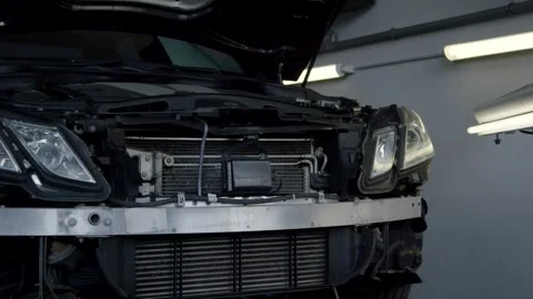 Dark Car Front with Open Hood, Automotive Repair Workshop, Slow Tracking Shot Видео 341517645