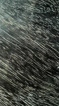 A dark chalkboard marked with white scratch lines, abstract textured background Foto stock