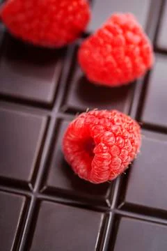 Dark chocolate bar with raspberry Stock Photos
