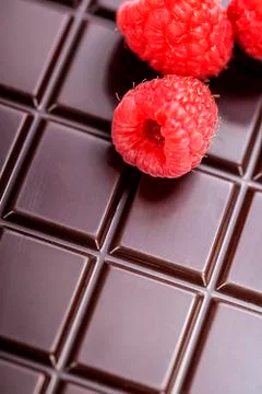 Dark chocolate bar with raspberry Stock Photos