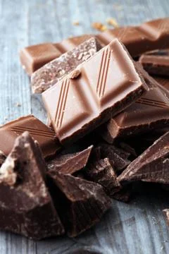 Dark Chocolate chunks and stacked broken chocolate bar Stock Photos