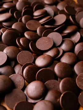 Dark Chocolate COUVERTURE chips Pistols buttons. Confection and pastry concep Foto stock