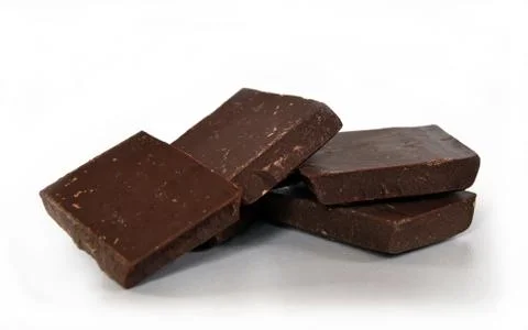 Dark chocolate cubes stack on white background 스톡 사진