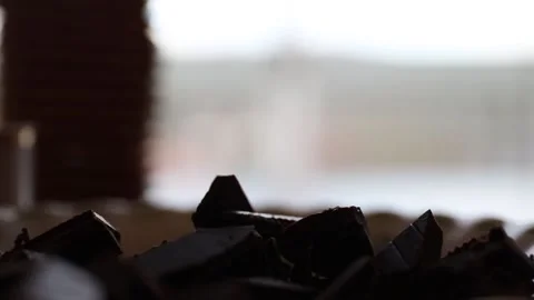 Dark chocolate falling in a cup Stock Footage 130252953