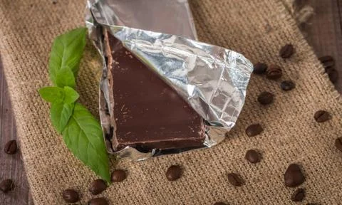 Dark chocolate with mint leaf Stock Photos