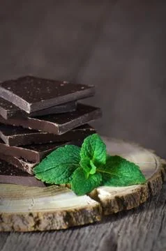Dark chocolate with mint leaf Stock Photos