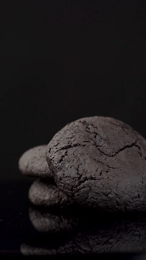 Dark Chocolate Sandwich Cookies Rotating on Dark Background Stock Footage 330517455