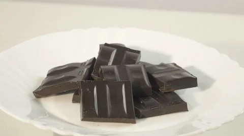 Dark chocolate on a saucer Video stock 58730659