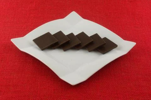 Dark chocolate squares Stock Photos
