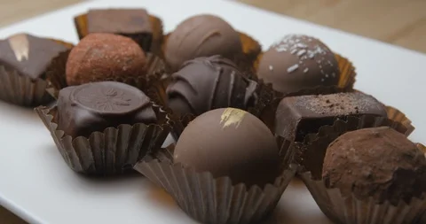 Dark chocolates rotating studio macro Stock Footage 101469334