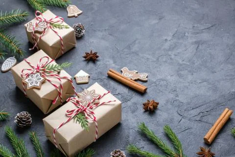 Dark Christmas background. Gift boxes, decorations and congratulations Stock Photos