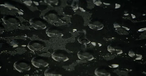 Dark cinematic close-up of water dripping from a leaking ceiling, with moody Stock Footage 318296485
