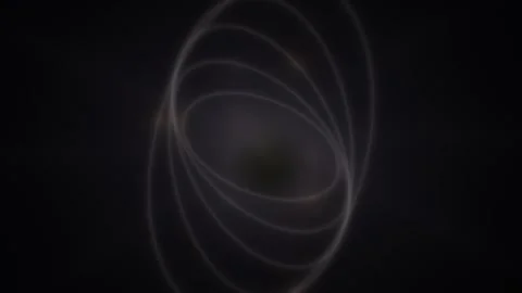 Dark circle swirls within white oval rings against black background Stock Footage 330922232