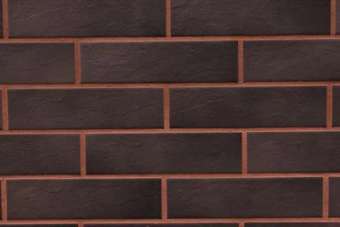 Dark clinker brick wall texture close-up Stock Photos