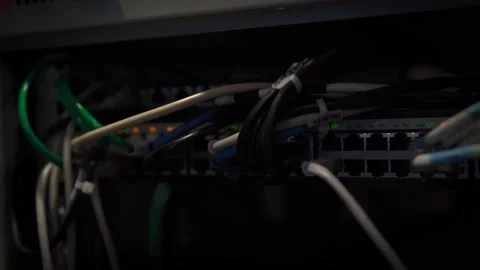 A dark close-up shot of the wires in the server room. Stock Footage 153976157