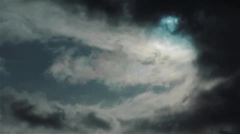 A dark cloud blotting the sun. Pan shot Stock Footage 47872807