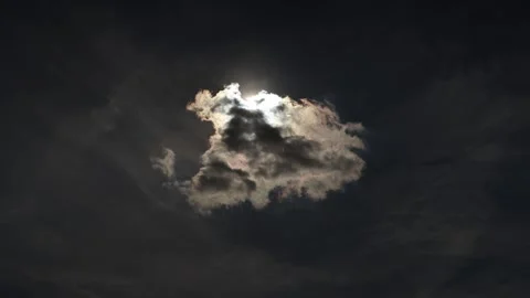 Dark cloud covers bright sunlight creating dramatic rays across the sky 스톡 동영상 346804729