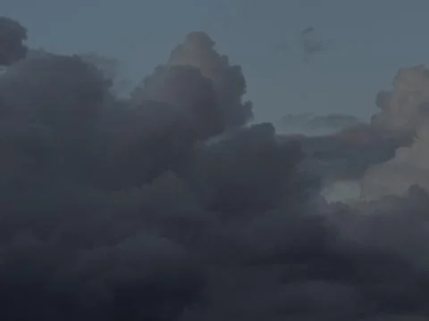 A dark cloud is creeping over the blue sky Stock-Fotos