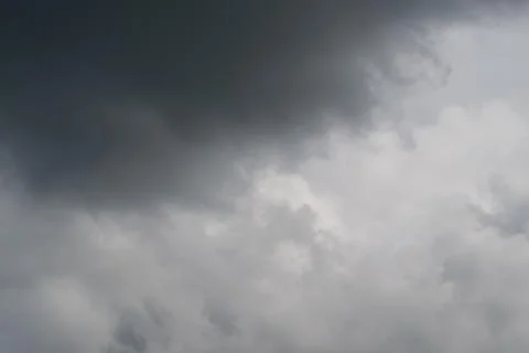 Dark cloud edge revealing silver lining, soft backlight, glimmering highlight Stock Photos