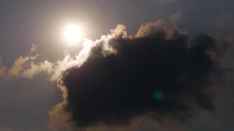 Dark cloud hit by the yellow sunrays and sun light Stock Footage 287536644