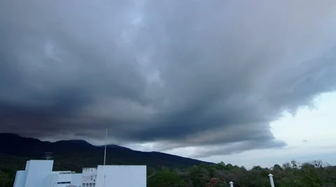 Dark cloud movement over the building and mountain range Stock Footage 47733238