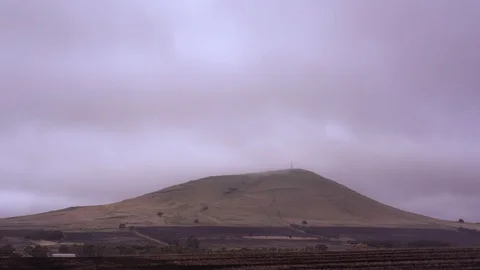 Dark cloud over mountain and landscape at dusk Stock Footage 94884644