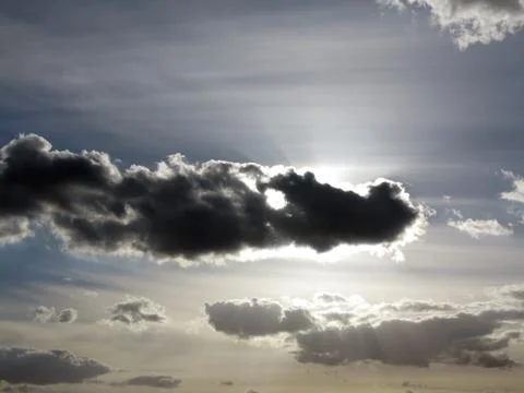 Dark cloud on the sky in backlight Stock Photos