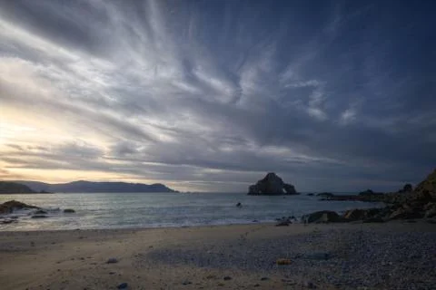 Dark clouded sunset on the beach Foto stock
