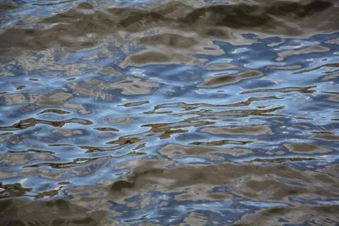 Dark clouds above the earth created a fabulous picture of the water Stock Photos