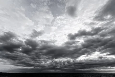 Dark clouds and light in background Stock Photos