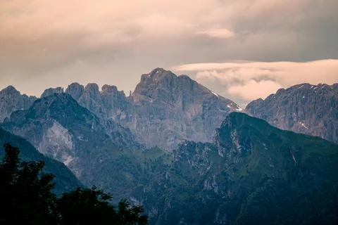 Dark clouds and rain over mountains in Dolomites, Italy Stock Photos