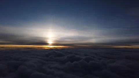 Dark clouds and sun from a plane Stock Footage 130019604