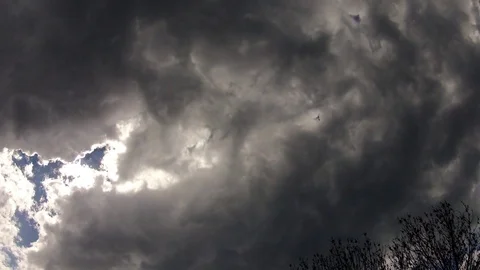 Dark clouds of a approaching storm in the summer sky Stock Footage 73786763