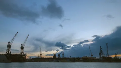 Dark clouds are flying over the seaport at the end of the day Stock Footage 164324589