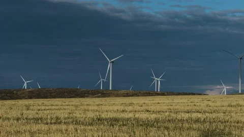 Dark Clouds Behind wind farm Windmills 60fps 2x slow Video stock 237486337