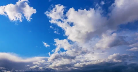 Dark clouds on the blue sky Stock Footage 128128394