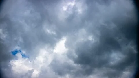 Dark clouds in the blue sky Stock Photos