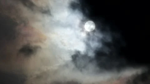 Dark clouds with bright sun beams - sky background, sunrays - real time Stock Footage 153843751