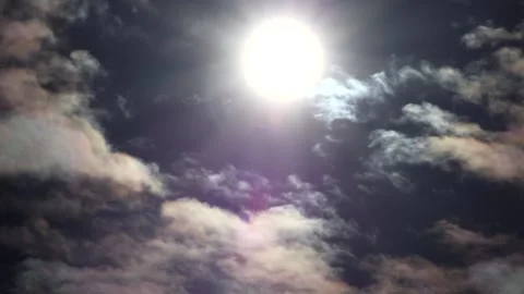 Dark clouds with bright sun beams - sky background with sunrays - Time Lapse Stock Footage 153845102