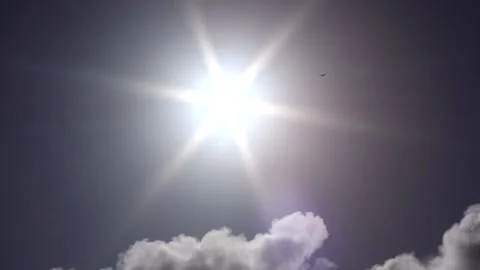 Dark clouds with bright sun beams - sky background, birds, sunrays - real time Stock Footage 153952279