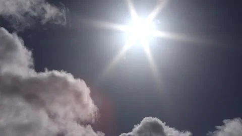 Dark clouds with bright sun beams - sky background, birds, sunrays - real time Stock Footage 153952371