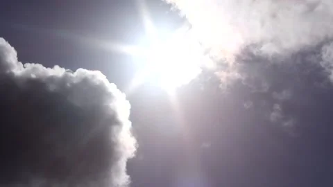 Dark clouds with bright sun beams, bird - sky background, sunrays - Real Time Stock Footage 153953890