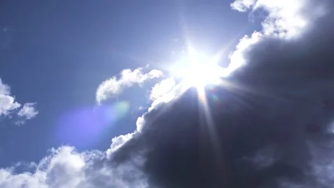 Dark clouds with bright sun beams - sky background with sunrays - Time Lapse Stock Footage 154202000