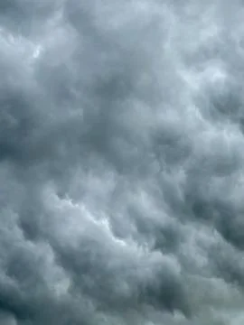 Dark clouds cover the sky before the storm arrives in the late afternoon Stock Photos