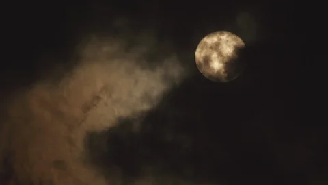 Dark clouds covering the full moon at night Stock Footage 103784522